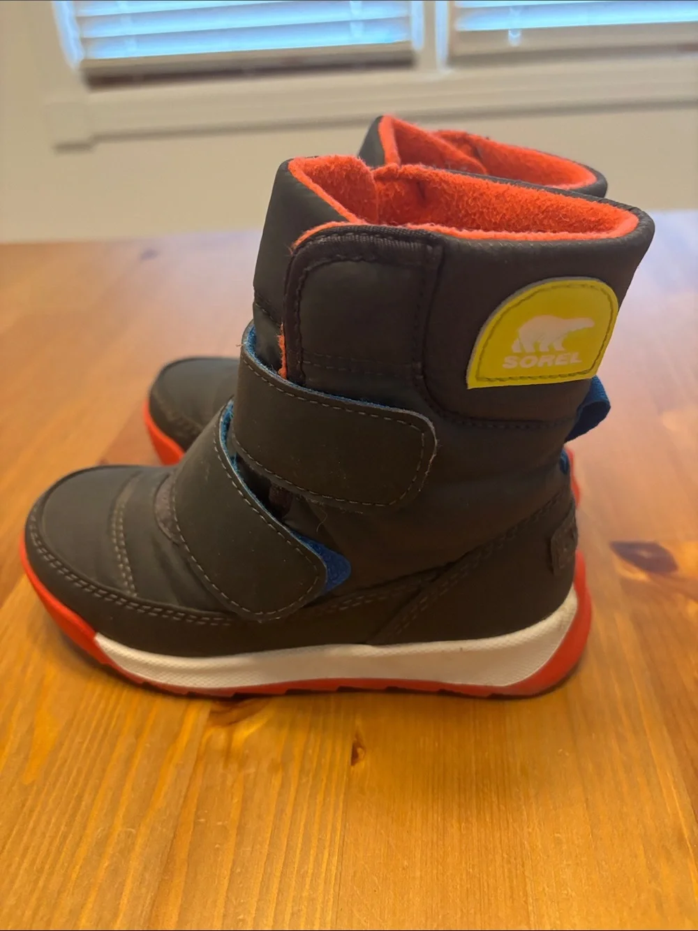 Sorel Kids Black Winter Boots with Red Lining and Red Soles